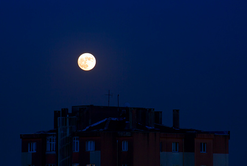 Full bloody orange moon in the dark sky in istanbul turkey