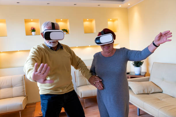 istock Elderly Man and his Wife are Browsing a Virtual World with Virtual Reality Goggles. 1326851835