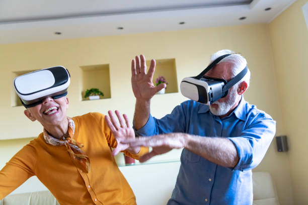 istock Excited Senior Couple is Using VR Goggles and Gesturing with Their Hands. 1326852385