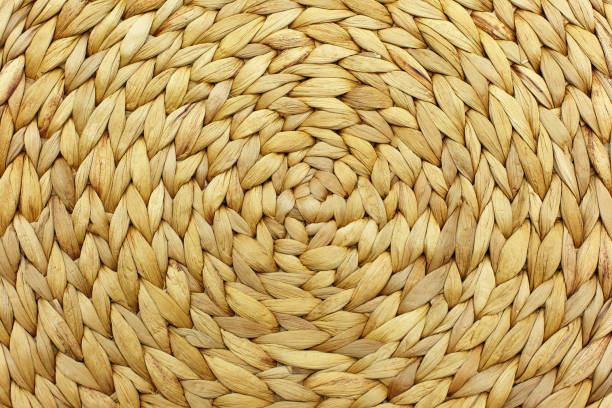 istock Dry banana leaf artwork background with circle structure. Wicker placemat background. Round traditional handmade rattan pattern. 1326854414