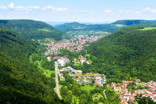 Lichtenstein town view from Lichtenstein Castle, Germany, Europe. Landscape of Black Forest in Swabian Alps. Scenic panorama of city between mountains in Baden-Wurttemberg. Alpine nature in summer.