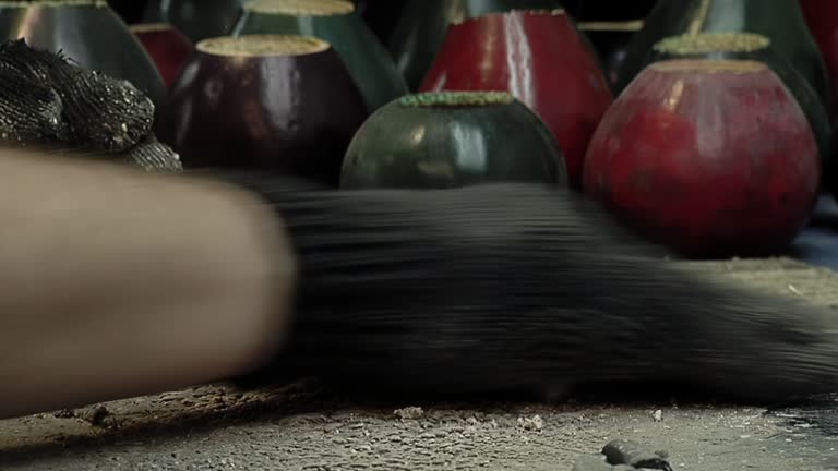 Worker manufacturing Yerba Mate Gourd at his Workshop in Buenos Aires, Argentina. Close Up.
