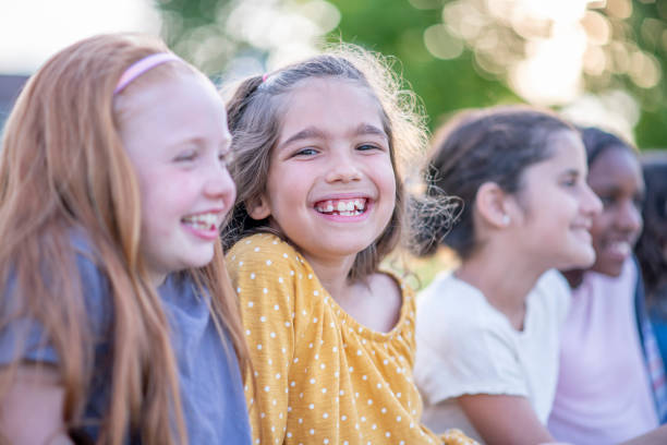 istock Elementary school children enjoying the summer together 1326860347