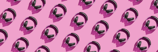istock Many same headphones on bright background. Modern music concept 1326861780