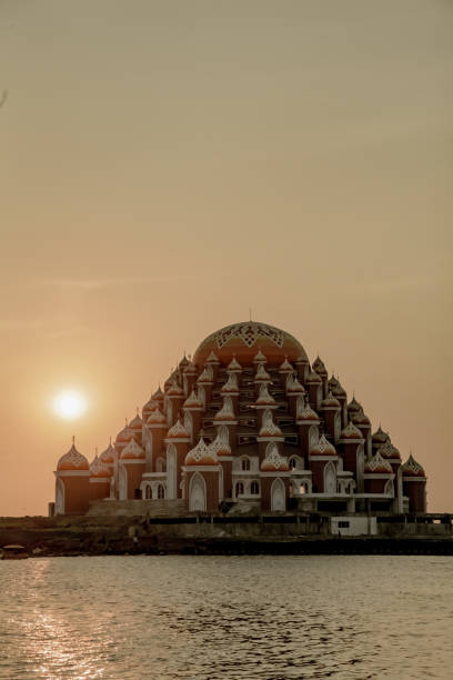 istock Sunset behind Beautiful Mosque in Indonesia 1326863191