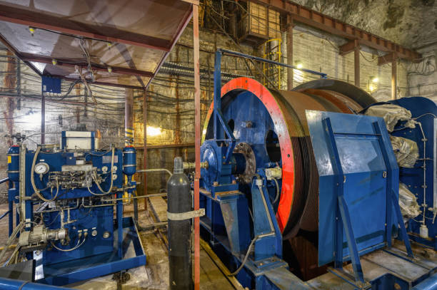 istock Huge shaft elevator machine. Modern equipment for lifting and lowering the cage shaft 1326865210