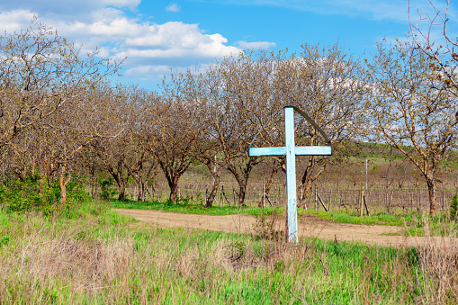 Cross made of iron and rock with the inscription \