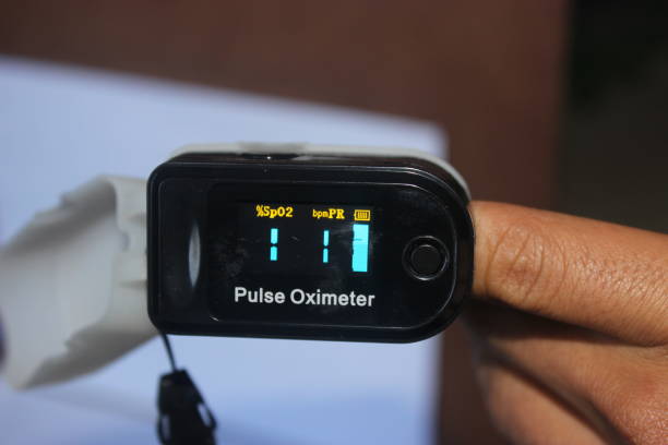 istock Closeup of a finger inside a pulse oximeter. 1326867618