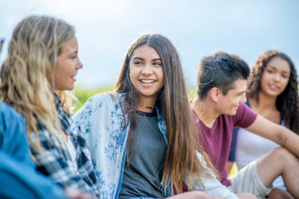 istock Multi ethnic group of  teenagers hanging out together 1326868331