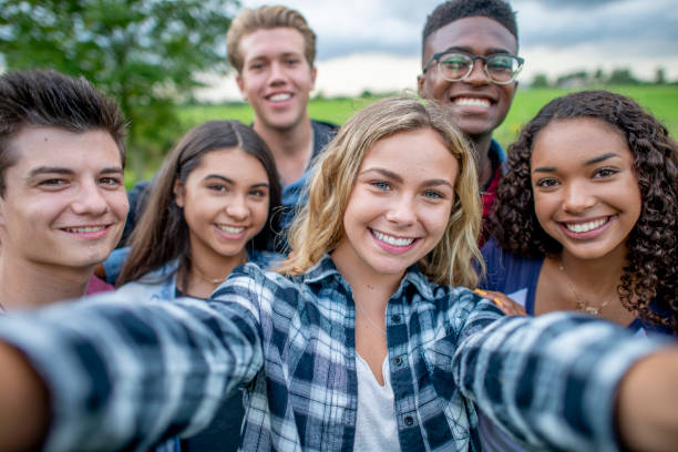 istock Multi ethnic teenagers taking a group selfie 1326868338
