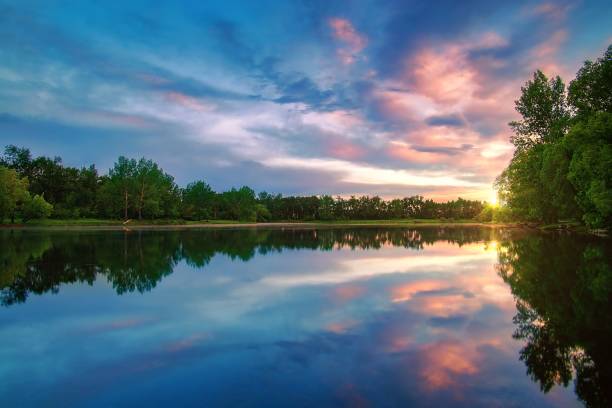 istock Sunrise Clouds Over A Summer Lake In Calgary 1326869143