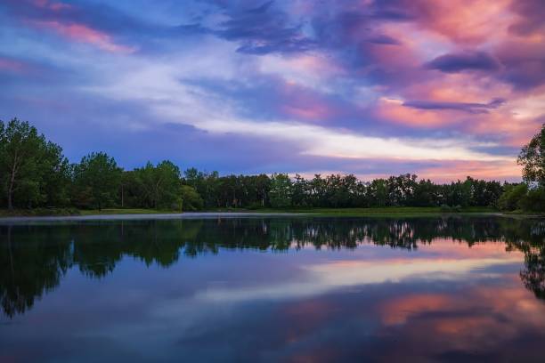 istock Sunrise Clouds Over A Summer Lake In Calgary 1326869144