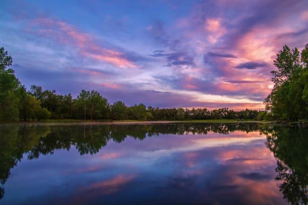 istock Sunrise Clouds Over A Summer Lake In Calgary 1326869149
