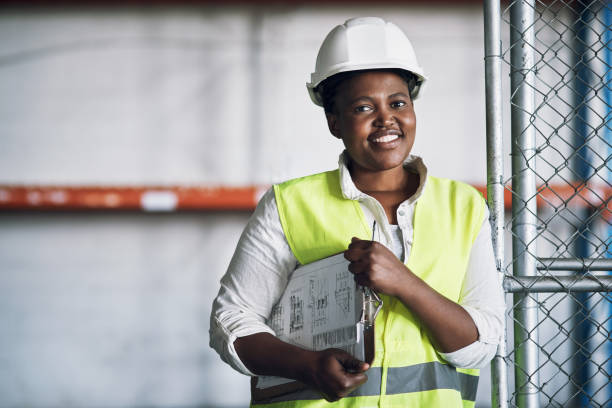 istock Portrait of a confident young woman working a construction site 1326870615