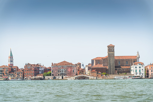 San Marco square with tower and basilica on the background in Venice. Back view with copy space