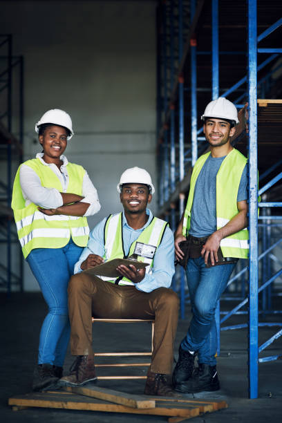 istock Portrait of a group of builders working at a construction site 1326873137