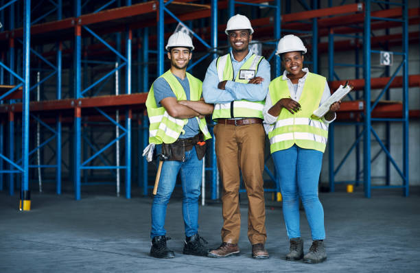istock Portrait of a group of builders working at a construction site 1326873138