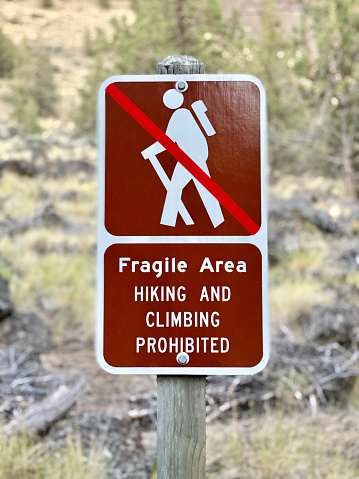 Fragile Area Hiking and Climbing Prohibited warning sign.