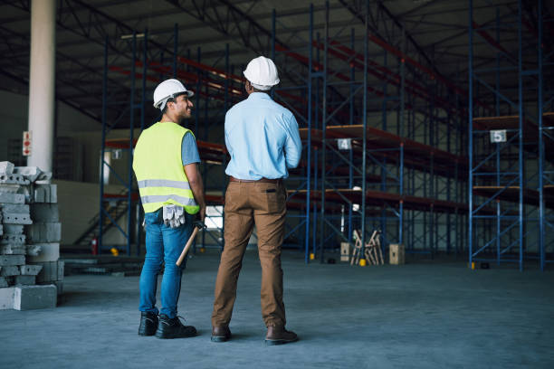 istock Shot of two builders inspecting a construction site 1326875006