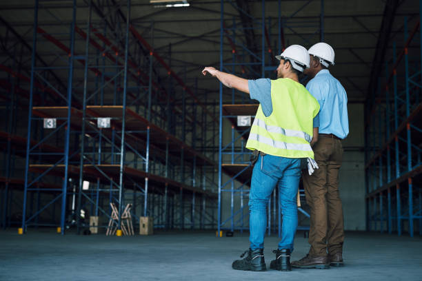 istock Shot of two builders inspecting a construction site 1326875010