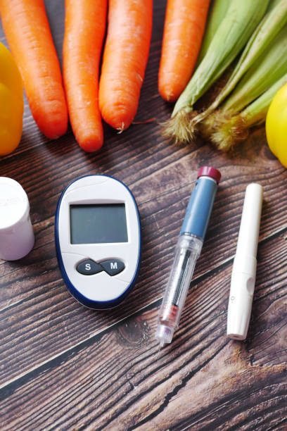 diabetic measurement tools and fresh vegetable on table