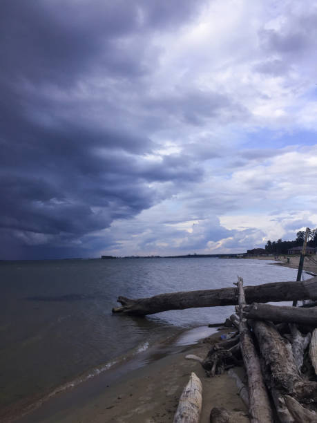 black storm clouds over the lake shore. an impending thunderstorm. the approach of rain.