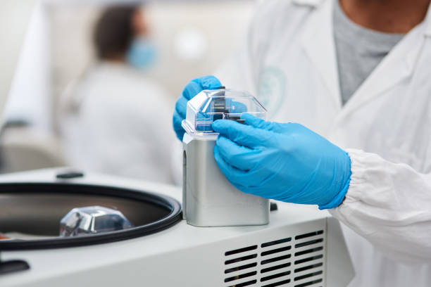 istock Shot of a lab-tech using a piece of machinery 1326892443