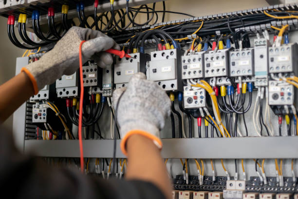 istock Electrician engineer uses a multimeter to test the electrical installation and power line current 1326896454