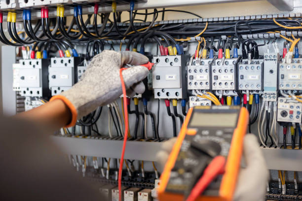 istock Electrician engineer uses a multimeter to test the electrical installation and power line current 1326896471