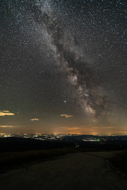 istock beautiful milky way above city 1326896628
