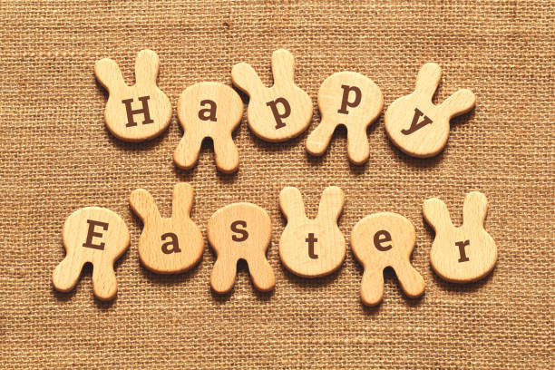 istock Rustic Easter card with wooden rabbits and letters 1326898415