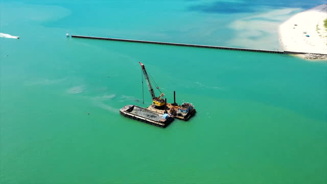 TL:Sand dredger working on the sea view from aerial