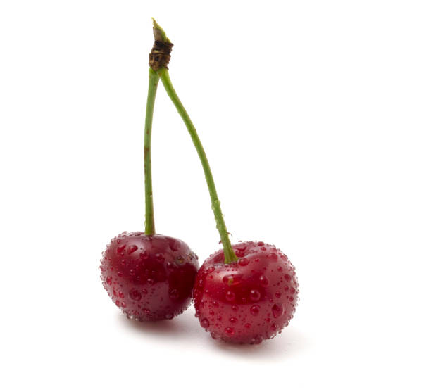 istock 2 red cherries in dew isolated on white background close up. 1326901793