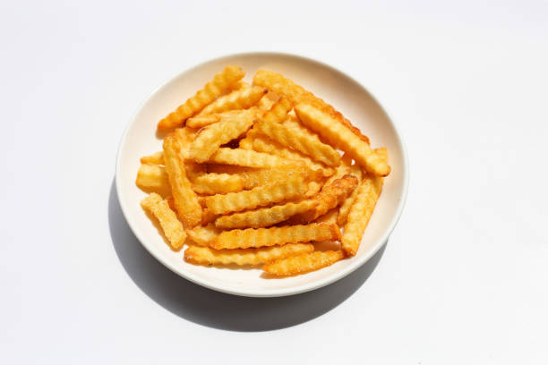 istock French fries on white background. 1326902667