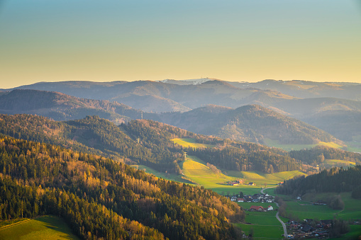 Germany, Aerial panorama view to feldberg mountain above hiking landscape and village of schwarzwald black forest tourism region at sunset