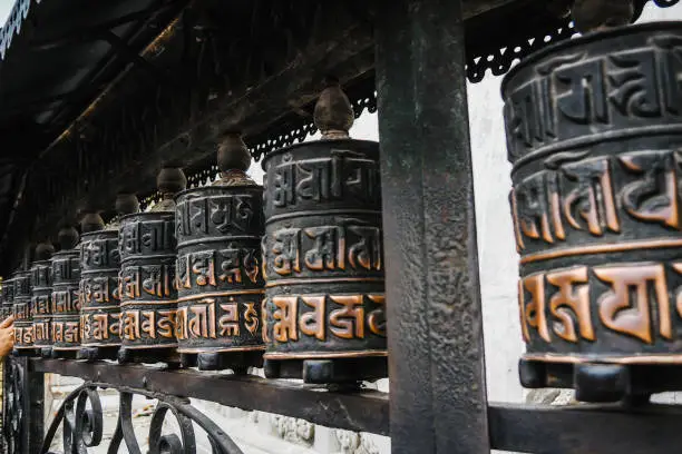 Close-up of ancient prayer wheel in Buddhist temple, Kathmandu, Nepal. Travel concept