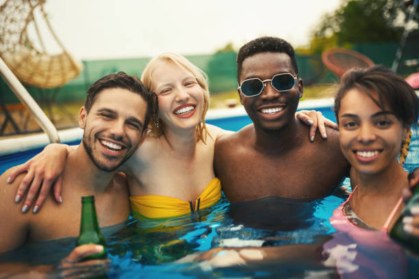 istock Friends having a pool party. 1326912120