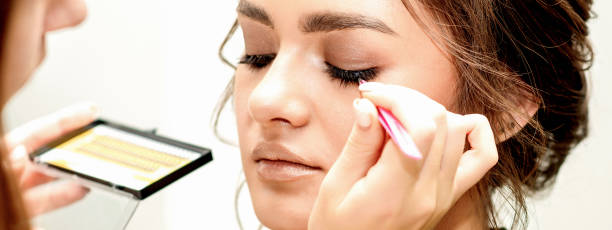 istock Young woman receiving eyelash extensions 1326912169