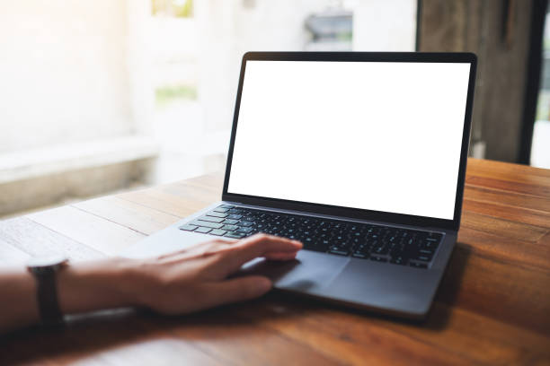 istock a woman using and touching on laptop touchpad with blank white desktop screen 1326912806