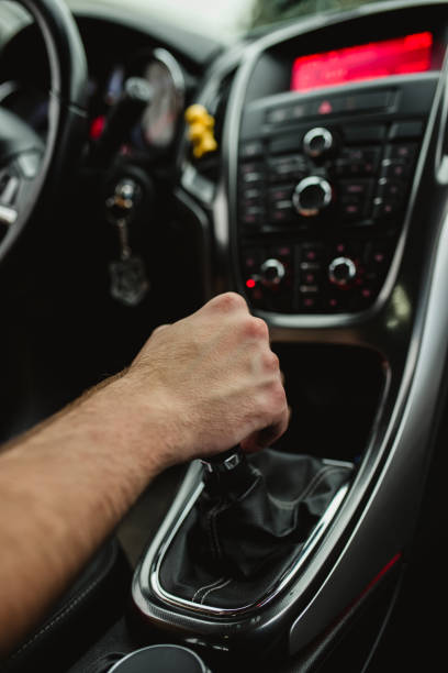 istock The driver holds his hand on the gear lever 1326912986