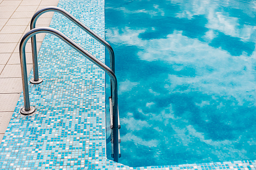 Pool ladder in swimming pool