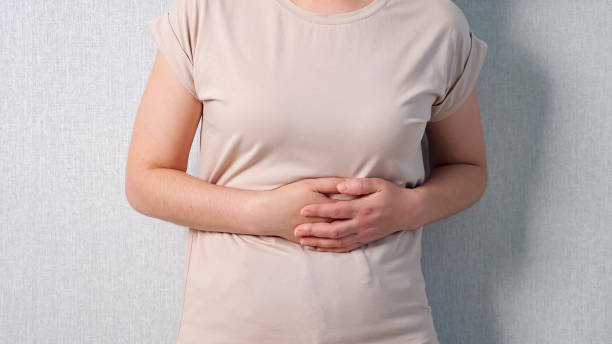 istock Unrecognizable woman holding belly feeling severe pain 1326917260