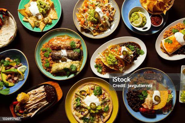 Typical Mexican Food Tacos Tamales Guacamole Tostadas Fajitas Top View On Wooden Background Stock Photo - Download Image Now