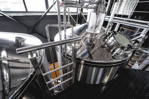 istock Craft beer brewing equipment in privat brewery 1326920244