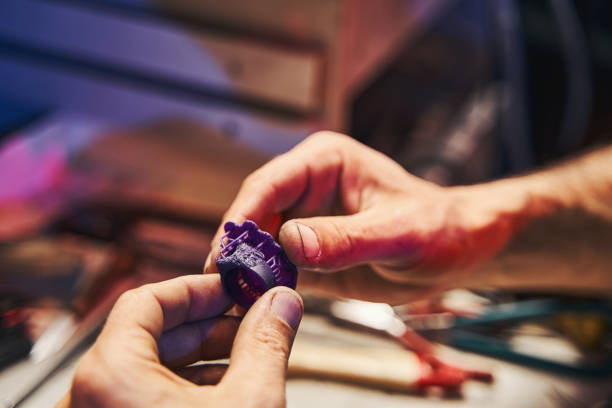Jeweler preparing a wax model of ring