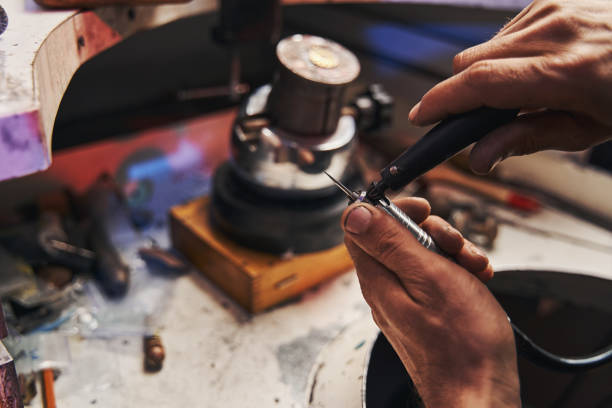 istock Jewelry maker installing new burr to drill device 1326921931