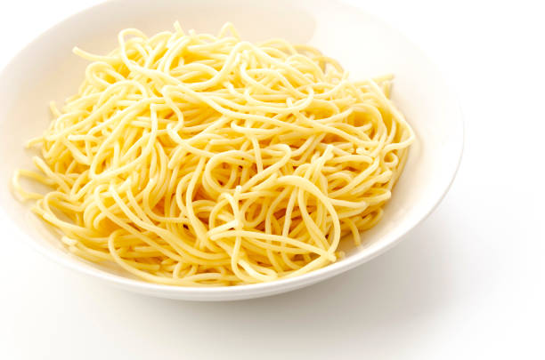 istock Spaghetti Noodles in Plate on White Background 1326922807
