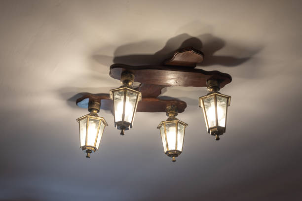 istock Vintage lustre with decorative lanterns hangs on ceiling 1326923374