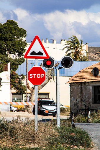Torrellano, Alicante, Spain- July 3, 2021: Signposted level crossing in Torrellano a small village of Alicante, next to the airport in summer.