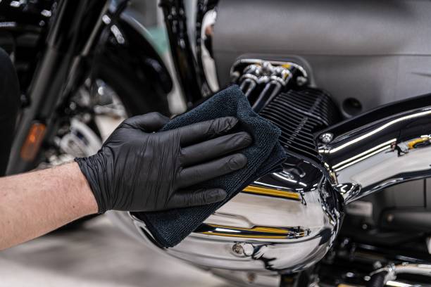 istock Polishing and cleaning chrome motorcycle part. 1326923523